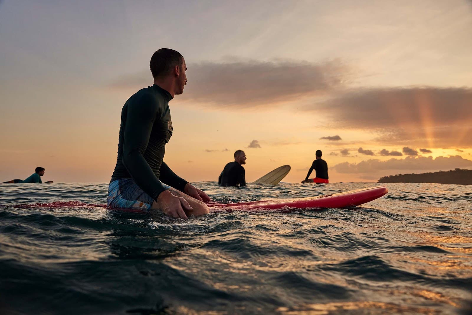 Surfer silhouette at sunset